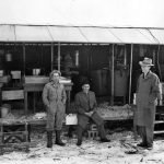 Virginia Meat Canner, 1940s, with Dan Smucker (left), Lewis S. Martin, and Wayne Henard, MCC Representative (MCC Photo)